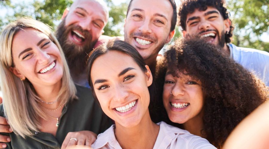 Multiracial people taking selfie outdoors - Happy life style concept with young smiling friends having fun.
